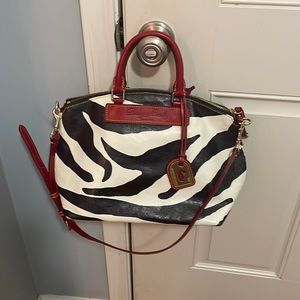 Genuine Dooney and Bourke leather zebra with red trim satchel